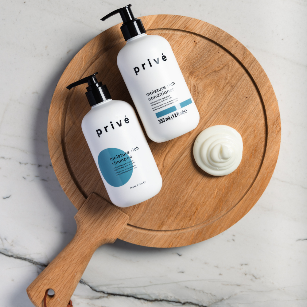 privé moisture rich conditioner - product on wood