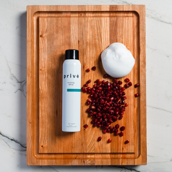 privé styling whip - product on wood